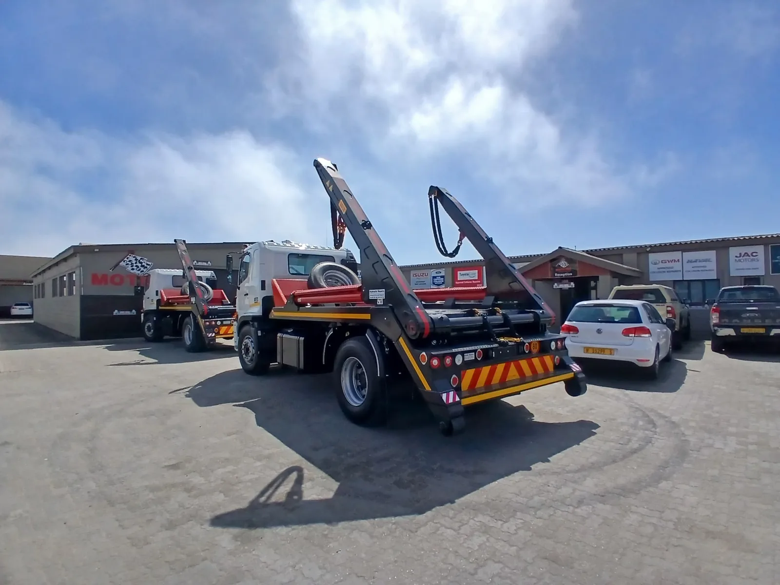 Skip-loader truck in the Mototec yard